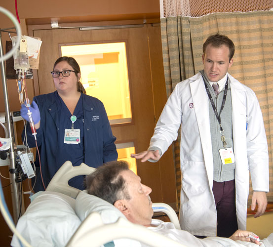 Pharmacists talking with patient
