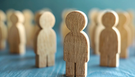 Employer Resource Center card - a group of small wooden figures on a table