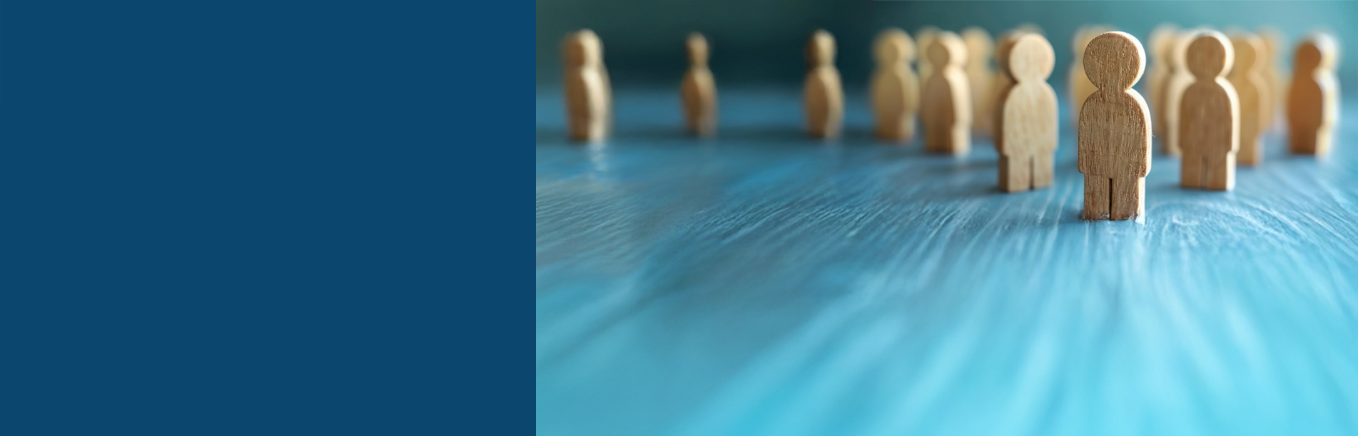 Employer Resource Center header - a group of small wooden figures on a table