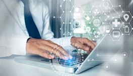 healthcare professional on a laptop and medical icons floating