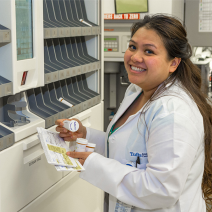 female pharmacy tech sorting meds