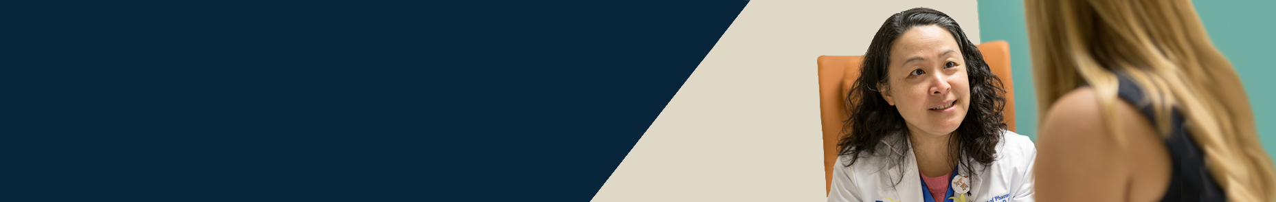 female healthcare professional talking with a female patient